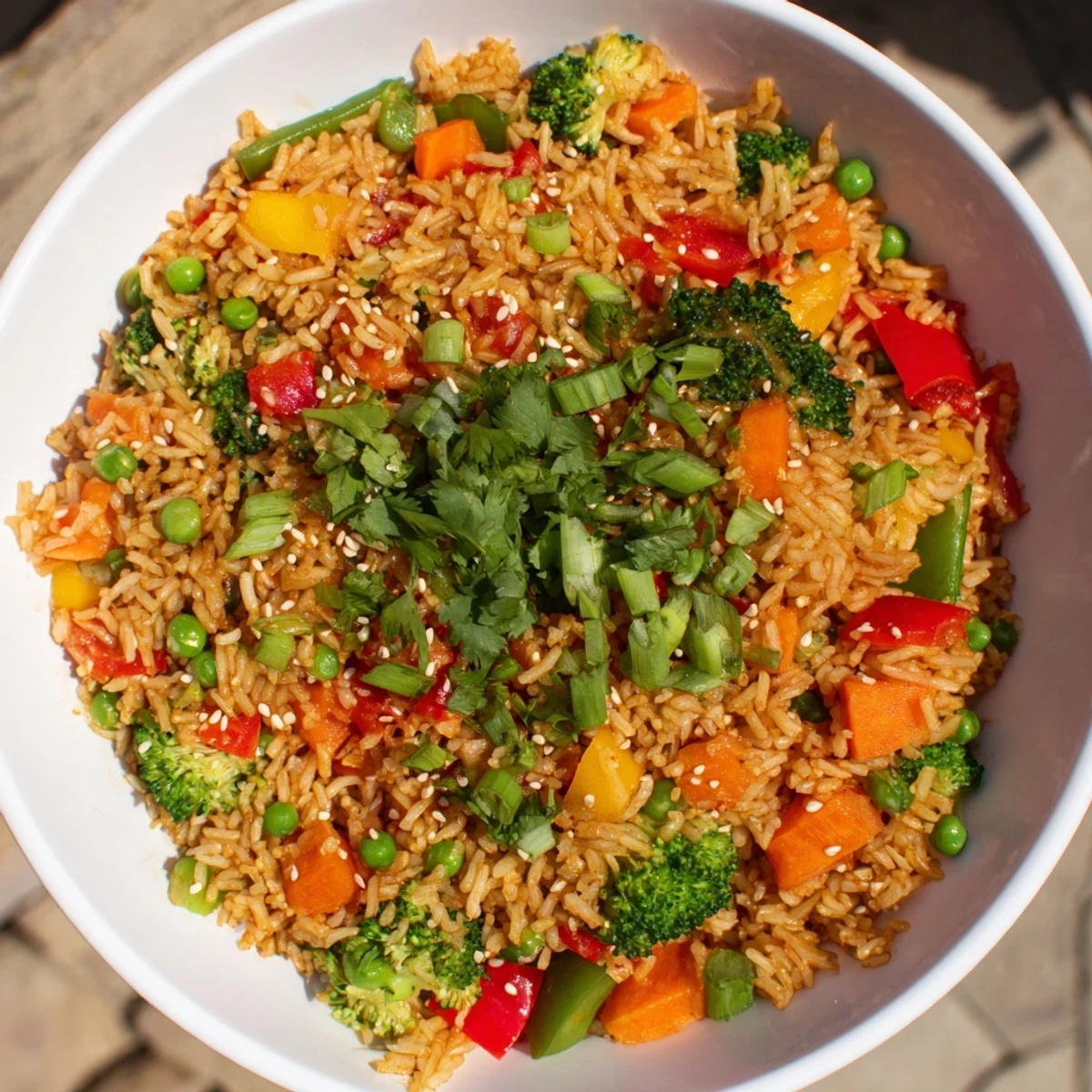 Golden, crispy vegetable fried rice bowls with colorful veggies, a quick and delicious dinner.