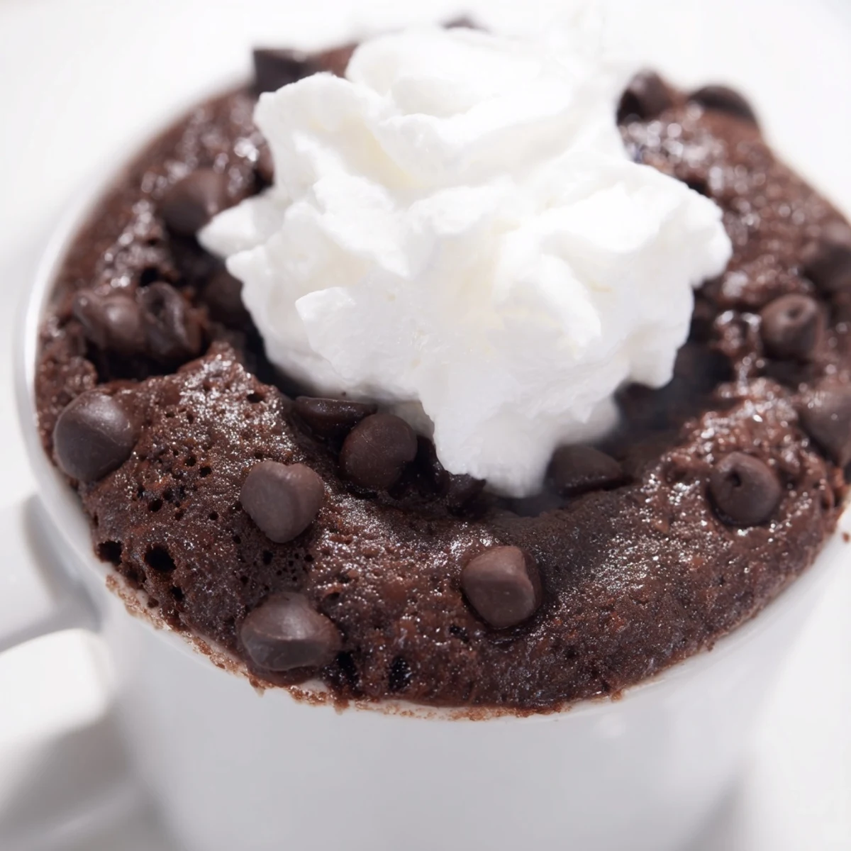 A single serving of fluffy chocolate mug cake, ready in minutes, ideal for chocolate cravings.