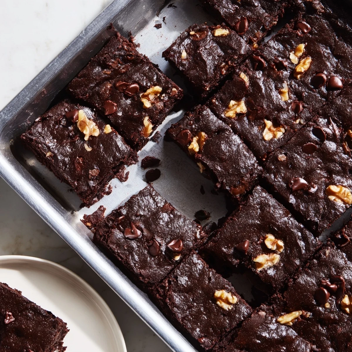 Gooey, dark Fudgy Walnut Brownies in One Baking Pan, perfectly baked with a crackly top, ready to serve.