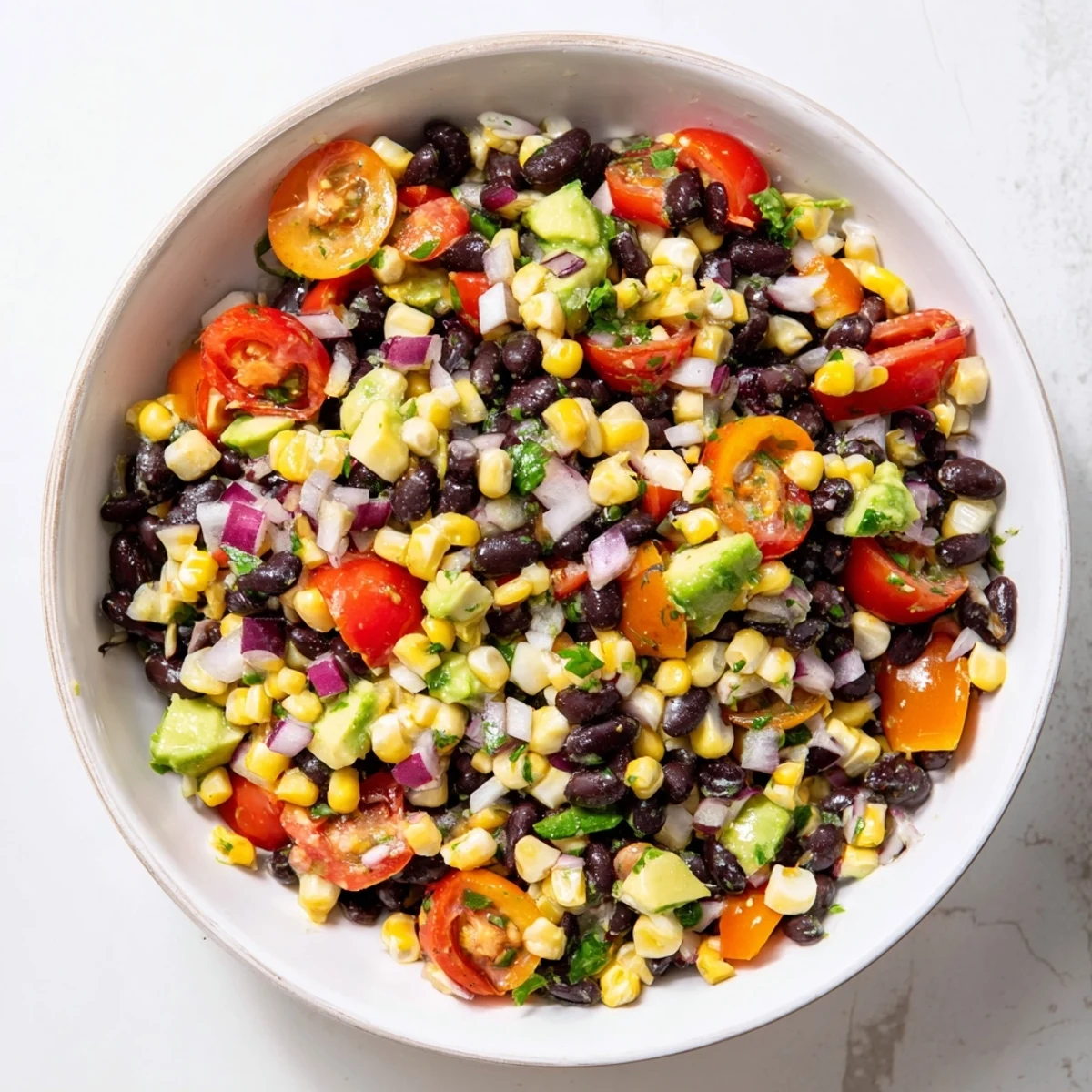 Vibrant Southwestern black bean and corn salad, a colorful vegetarian delight with fresh lime dressing.