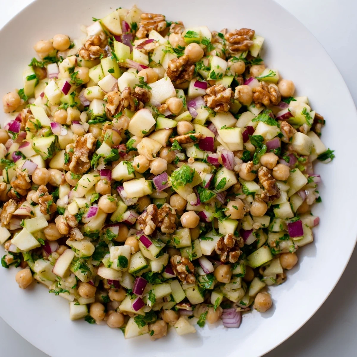 Vibrant Fall Harvest Apple and Chickpea Salad with crisp apples and a creamy honey-mustard dressing.