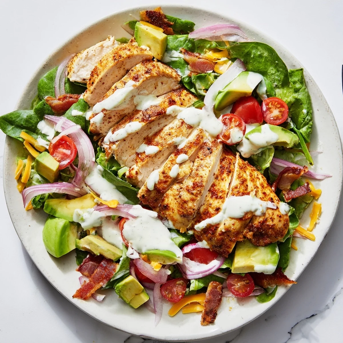 Fresh, flavorful Crispy Bacon Chicken Salad with glistening chicken and crispy bacon ready to eat.