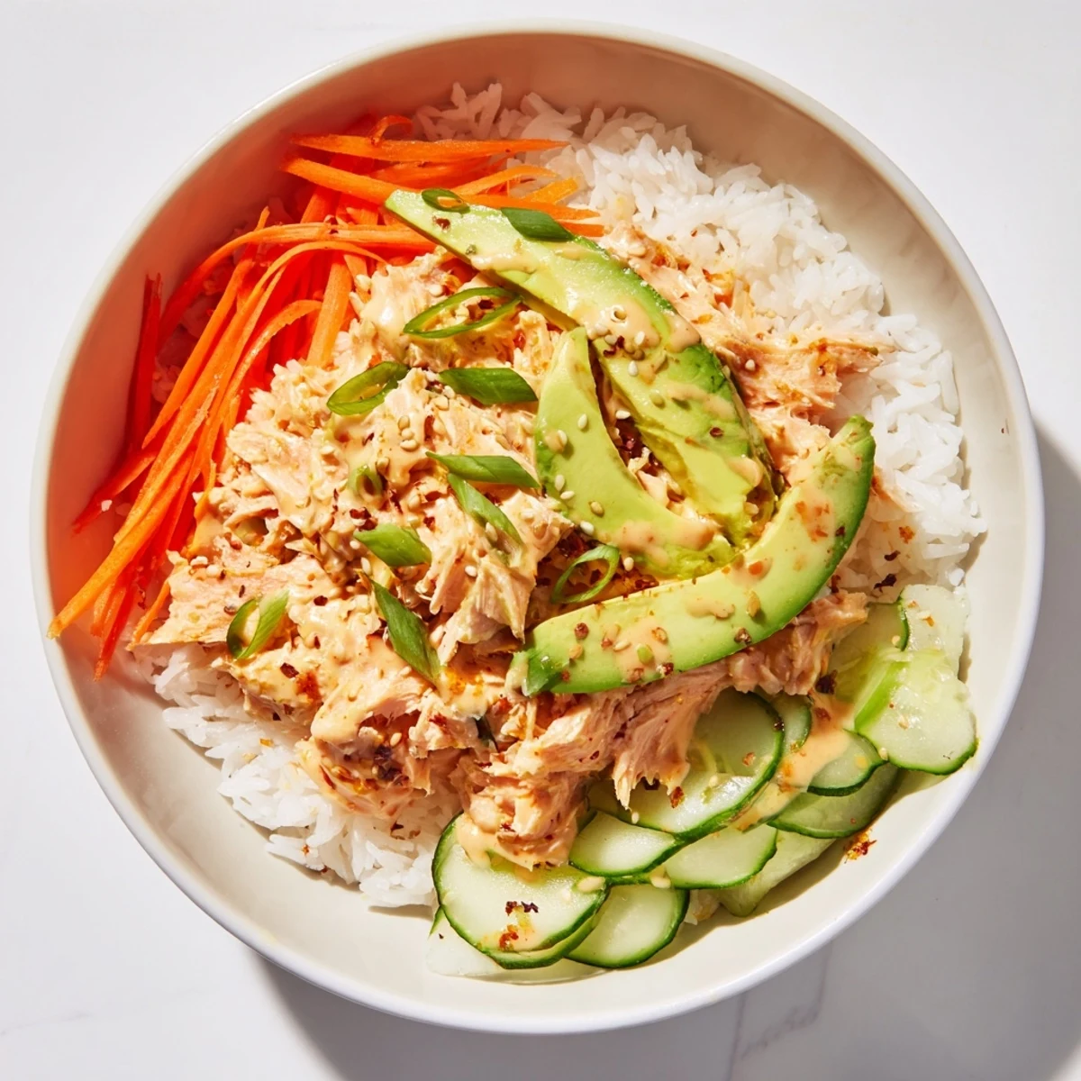 Enjoy a healthy and flavorful Spicy Canned Salmon Rice Bowl bursting with fresh ingredients.