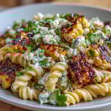 Creamy Mexican Street Corn Pasta Salad with charred corn and cotija cheese in a tangy lime dressing.