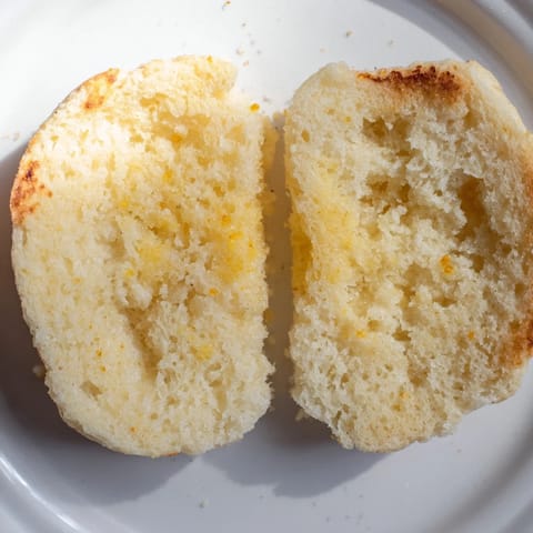 Warm, toasted sheet pan English muffins, perfect for a hearty and satisfying breakfast or brunch.