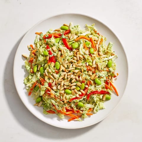 This wholesome Crunchy Cabbage and Edamame Salad features a creamy green dressing, ready to enjoy.