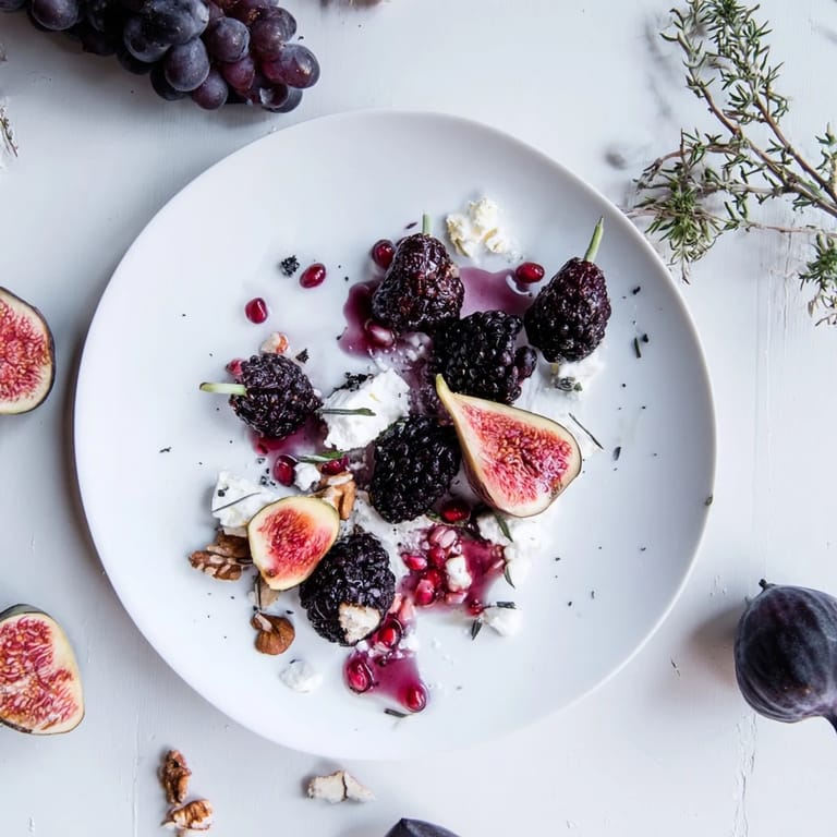 Sophisticated Midnight Orchard appetizer: ripe plums with creamy goat cheese, grapes, and optional walnuts.