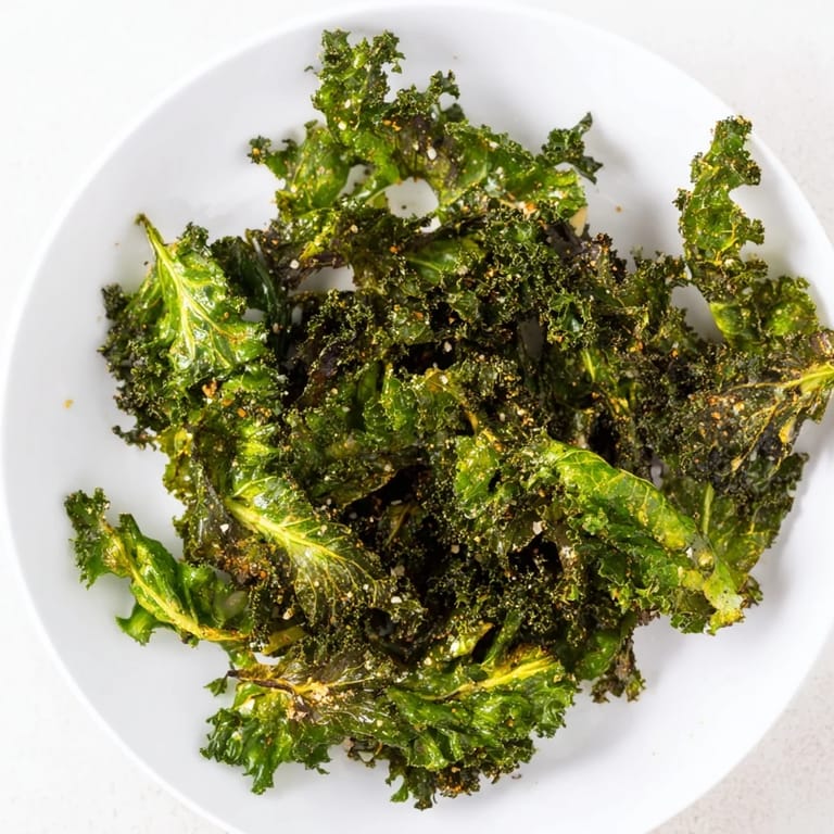 Oven-baked crispy kale chips: a simple, vegan snack with perfect salty, crunchy edges.