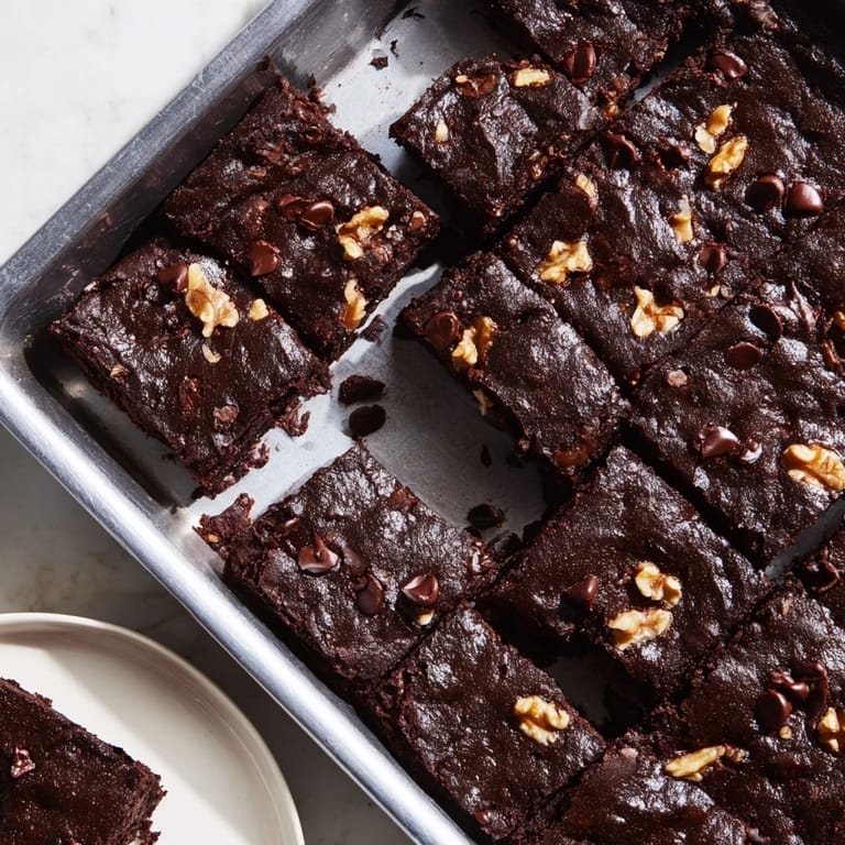 Gooey, dark Fudgy Walnut Brownies in One Baking Pan, perfectly baked with a crackly top, ready to serve.