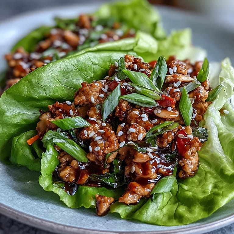Light and flavorful chicken lettuce wraps with hoisin sauce, crunchy water chestnuts, and fresh herbs for a satisfying appetizer or dinner.